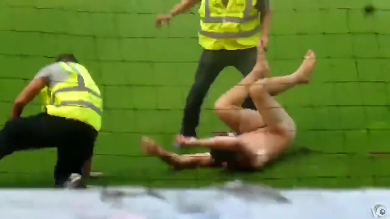 Nude maniac runs around the football field picture